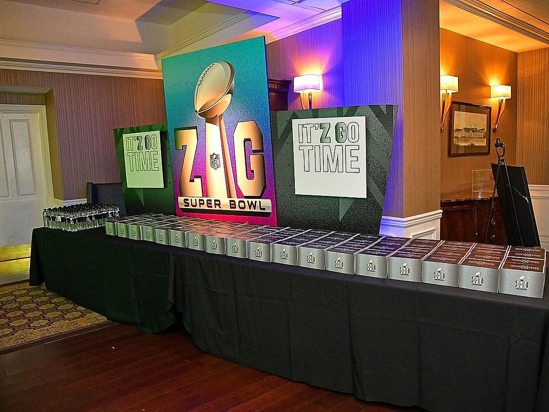 Party favor table before a football-themed display